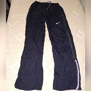 A pair of Nike nylon lounge pants. They're pre-loved and in great condition